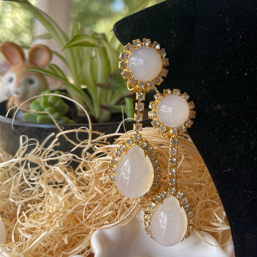 Gold tone drop clip on earrings.
